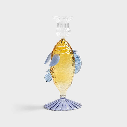 unique yellow candle holder with a fish-shaped design, adding a whimsical touch to home décor