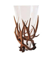 clear vase with brown poly resin base