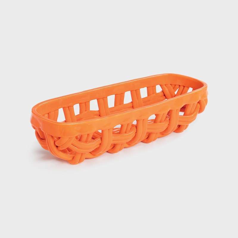 stoneware baguette basket orange has irregular braids