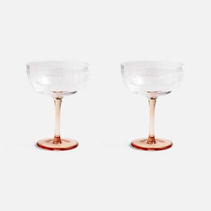 champagne coupe glasses solid pink colour and subtle engraved flower