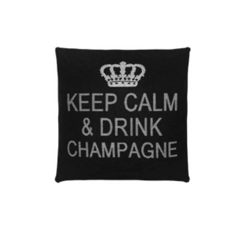 A black cotton cushion with a phrase Keep Calm & Drink Champagne on it