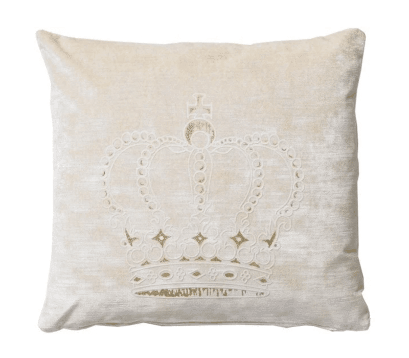A beige cotton velvet cushion with a crown pattern