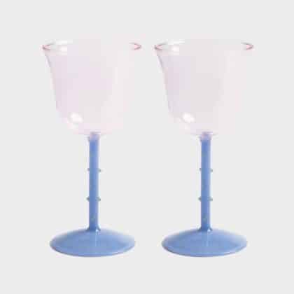 2 light pink wine glass with dots on it