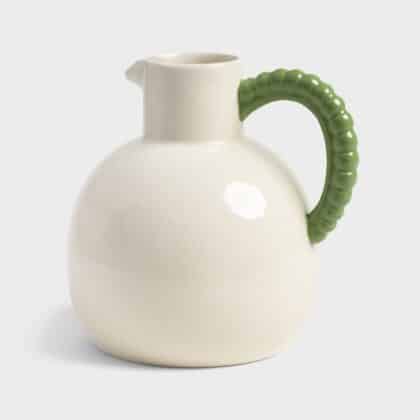 White jug with green handle