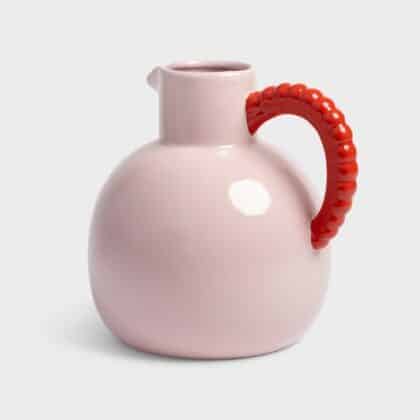 Pink jug with a red pearl handle