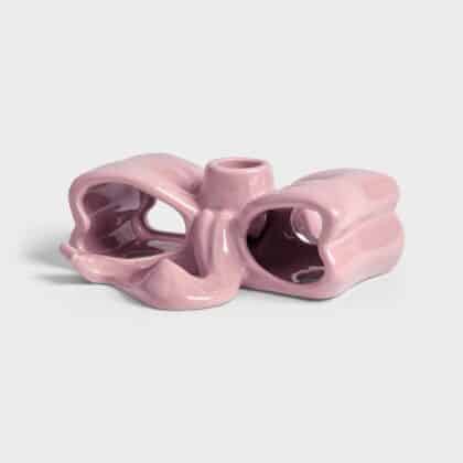 Pink candle holder with a ribbon shape