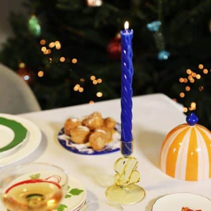 yellow glass candle holder with a puddle shape