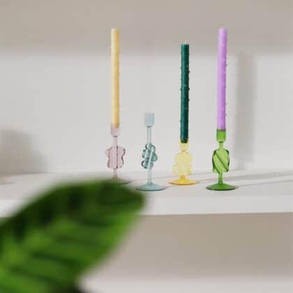 colorful glass candle holders with a puddle shape